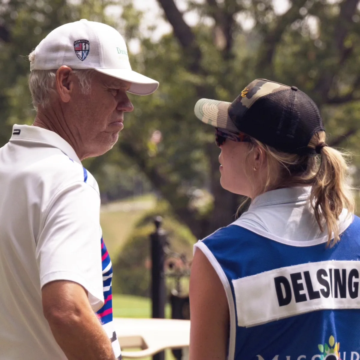 Jay Delsing on the course with his daughter caddying
